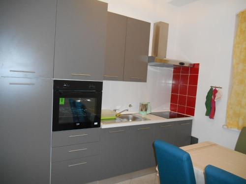 Kuchyňa alebo kuchynka v ubytovaní Rajan Apartman