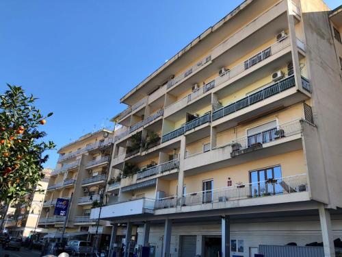 an apartment building with balconies on a city street at Casa Emilia in Sorrento