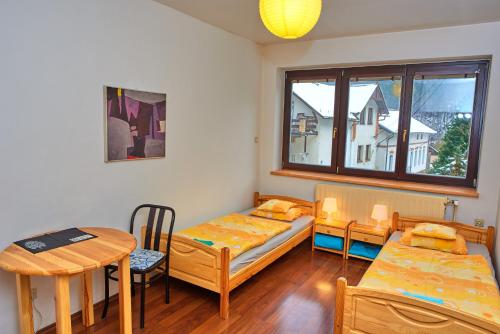 Postel nebo postele na pokoji v ubytování U Kosti - Bohemian Switzerland