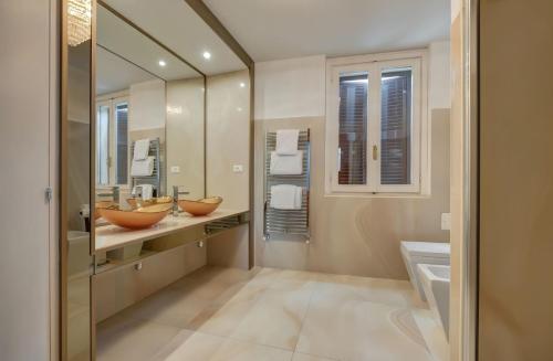 a bathroom with two sinks and a large mirror at Penthouse Suite Rome - Private Suites in Rome