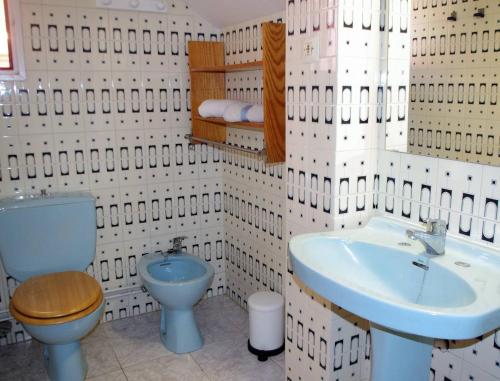 a bathroom with a toilet and a sink at REFUGI DE MAR WITH PRIVATE SWIMMING POOL AND FREE WIFi in Hospitalet de l'Infant