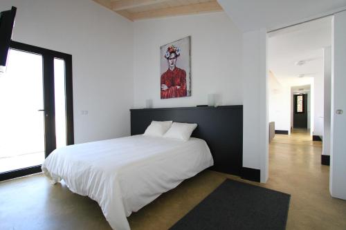 Posteľ alebo postele v izbe v ubytovaní Villa Puesta de Luna