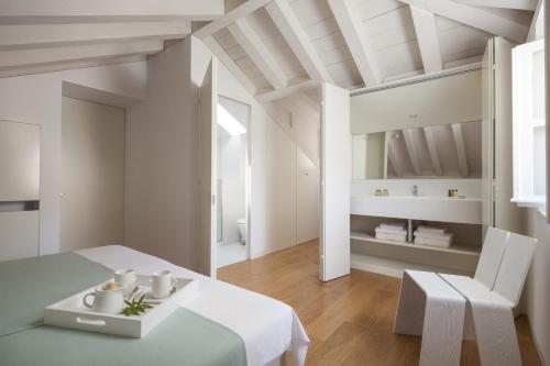 a white room with a table and a chair at Villa Orti in Dubrovnik