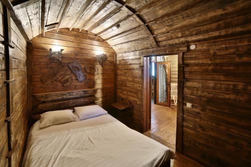 מיטה או מיטות בחדר ב-Voyage Hotel