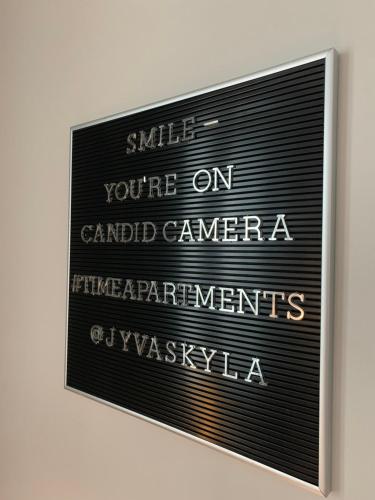 a sign that says smile youre on carded camera istg istg istg istg istg at The Harbour Apartments in Jyväskylä
