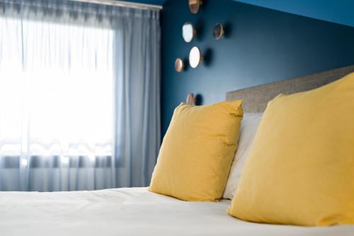 Postel nebo postele na pokoji v ubytování Radisson Hotel Aix En Provence