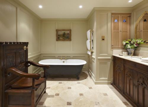 a large bathroom with a tub and a sink at Hazlitt's in London