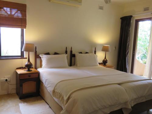 Ένα ή περισσότερα κρεβάτια σε δωμάτιο στο Afrikhaya Guest House