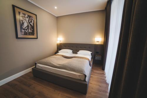 Hotel Irys by Derenivska Kupilにあるベッド
