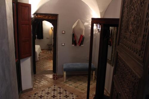 a bathroom with a large mirror and a tub at Hotel la Boheme in Cáceres