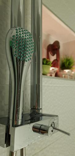 a glass appliance with a strainer in a kitchen at Apartment PLAZA -Wallbox 11kW- Private SPA- Jacuzzi, Infrared Sauna, Luxury massage chair, Parking, Entry with PIN 0 - 24h, FREE CANCELLATION 24 hours before Check In,Premium pillows and mattress in Slavonski Brod