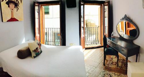Кровать или кровати в номере Hotel la Boheme
