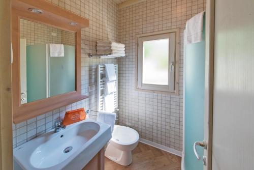 a bathroom with a sink and a toilet at Il Villaggio Di Giuele in Finale Ligure