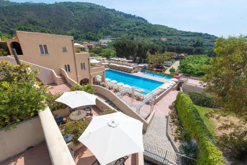 an external view of a villa with a swimming pool at Il Villaggio Di Giuele in Finale Ligure