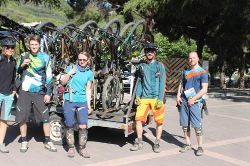 a group of people standing in front of a rack of bikes at Il Villaggio Di Giuele in Finale Ligure