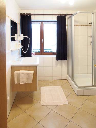 a bathroom with a sink and a shower at Giglerhof in Bad Birnbach