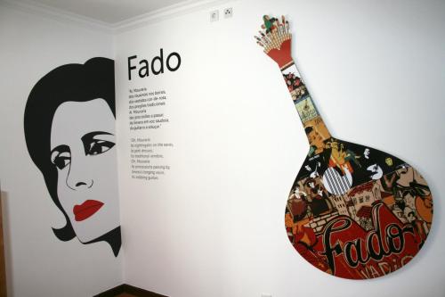 a guitar with a picture of a woman at Hostel 2300 Thomar in Tomar