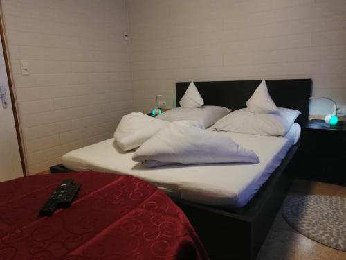 two beds with white pillows in a room at Apart Family Schweng in Tux
