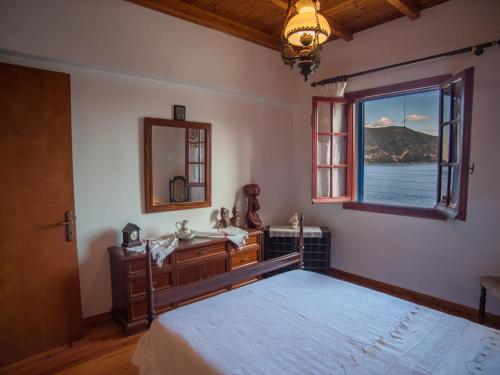 Posteľ alebo postele v izbe v ubytovaní Fey's House waterfront - Φισκάρδο