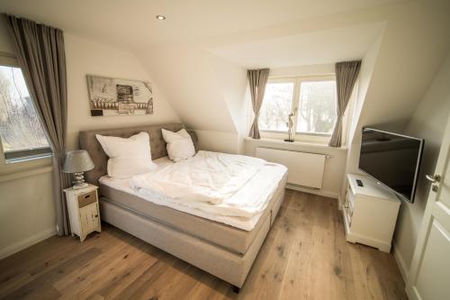 Tempat tidur dalam kamar di Haus Sonnenterrasse