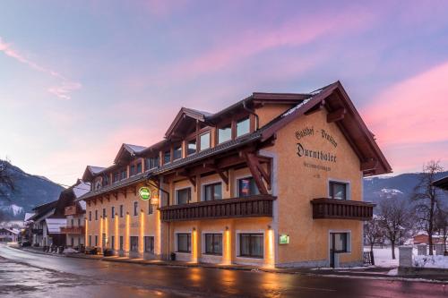 a large building on the side of a street at Gasthof - Pension Durnthaler in Tröpolach