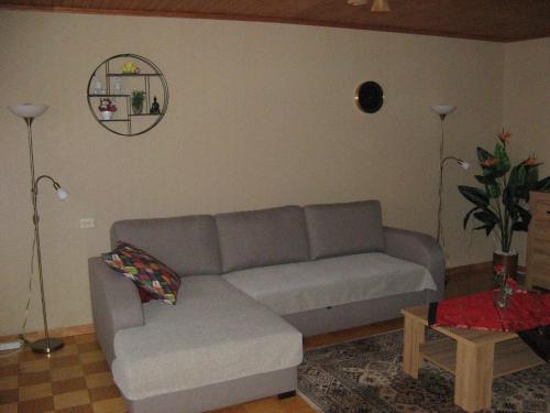 a living room with a couch and a table at Gratarre 2 in Kuressaare