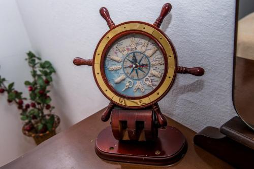 a clock sitting on top of a table at Apartments Klakor PS in Tivat