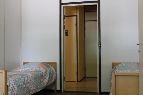 Ένα ή περισσότερα κρεβάτια σε δωμάτιο στο Guesthouse - Kuin Kotonaan
