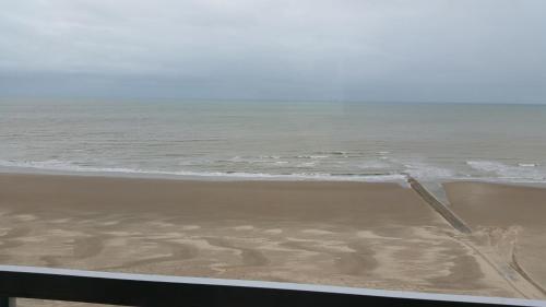 a view of the beach with the ocean at Studio On The Beach With Sea View in Middelkerke