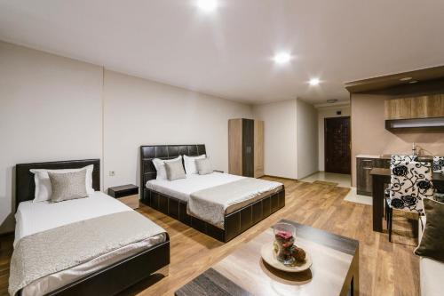 Ένα ή περισσότερα κρεβάτια σε δωμάτιο στο Family Hotel Ring & Thermal