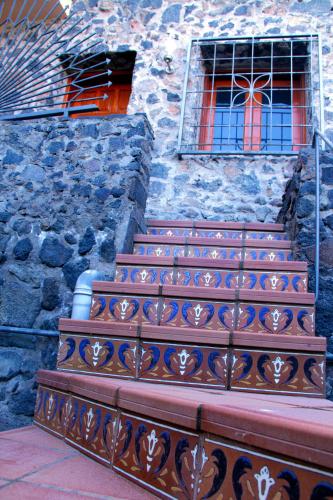 a set of stairs in front of a stone building at Finca La Punta in Icod de los Vinos