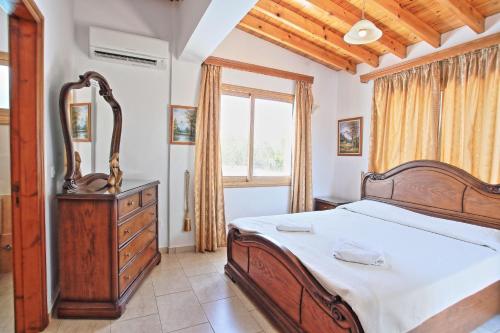 Postel nebo postele na pokoji v ubytování Marilena Sunset Villa 2