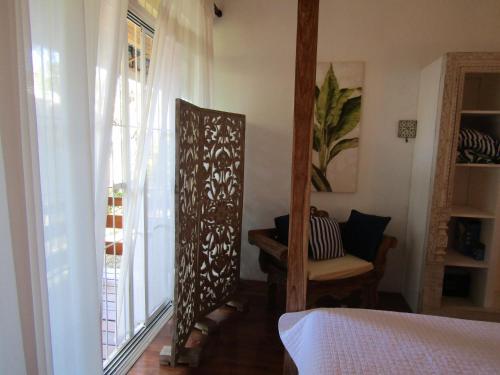 Ένα ή περισσότερα κρεβάτια σε δωμάτιο στο Pineapple house Manzanillo