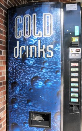 a cold drink machine with the words cold drinks on it at Magic Key - Near Disney in Kissimmee