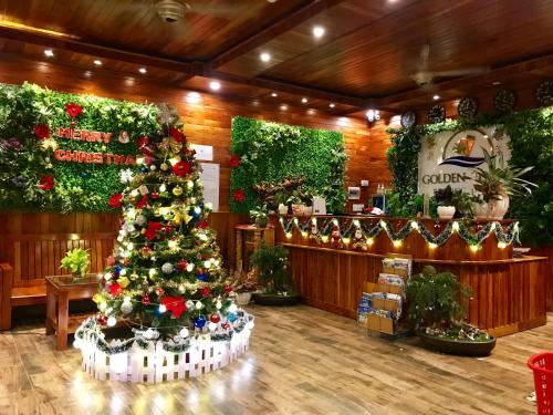 a christmas tree in the lobby of a store at Golden Topaz Phu Quoc Resort in Phu Quoc