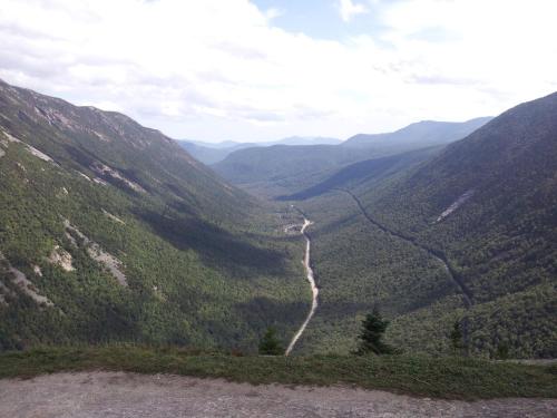 a view of a mountain valley with a road at Carlson's Lodge in Twin Mountain