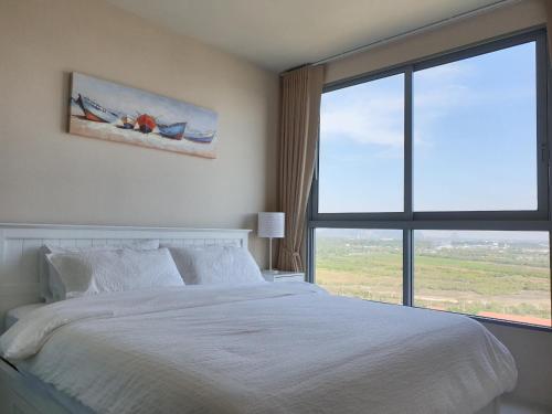 Postel nebo postele na pokoji v ubytování Blu Condo (Chaam - Huahin)