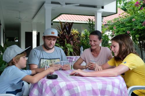 a group of people sitting around a table at Athiriveli in Thoddoo