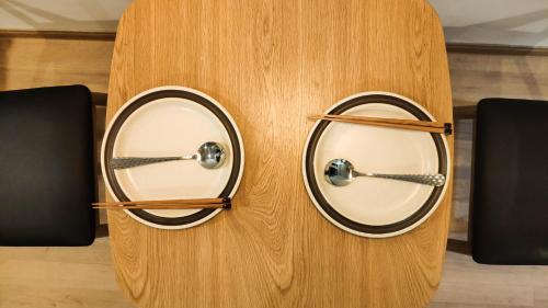 a pair of speakers on a wooden wall at Mimi House in Hoi An