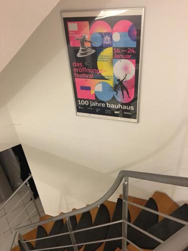a poster hanging on a wall above a staircase at Ferienimspessart OG in Bad Soden-Salmünster
