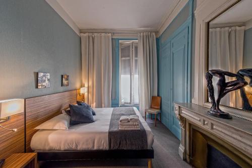 Posteľ alebo postele v izbe v ubytovaní Hotel de Paris