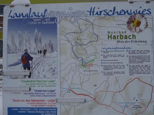 a sign for a ski resort with a map at Gasthof-Pension Nordwald in Harbach