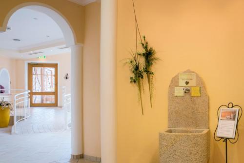a room with a cell phone on the wall at Hapimag Ferienwohnungen St Michael in Sankt Michael im Lungau