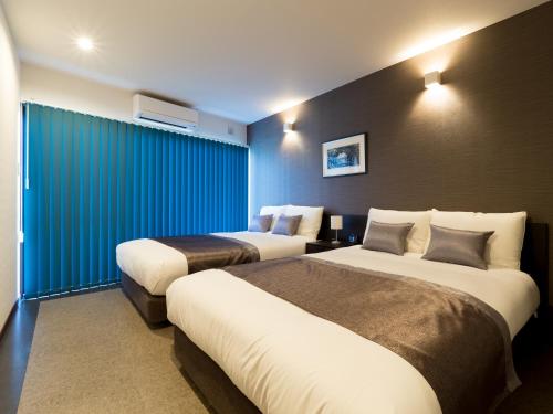 Кровать или кровати в номере Sumuide Terrace H