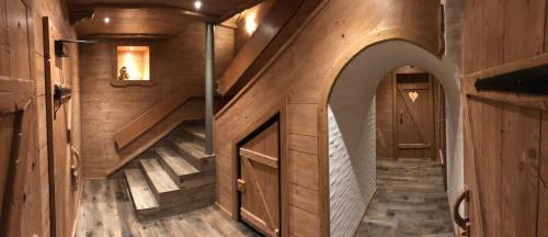 an inside view of a cabin with wooden walls and stairs at Gazauner Hof in Sankt Gallenkirch