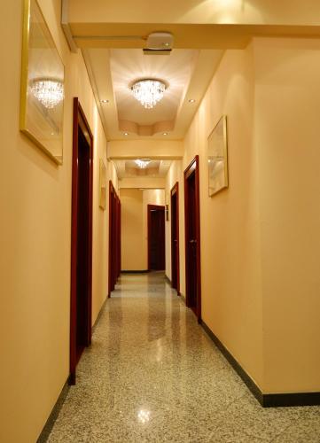 a corridor of a building with a long hallway at Hotel Kennedy in Nürnberg