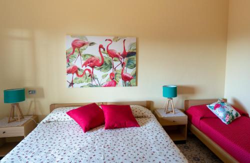 a bedroom with two pink pillows on a bed at Costamare in Monterosso al Mare