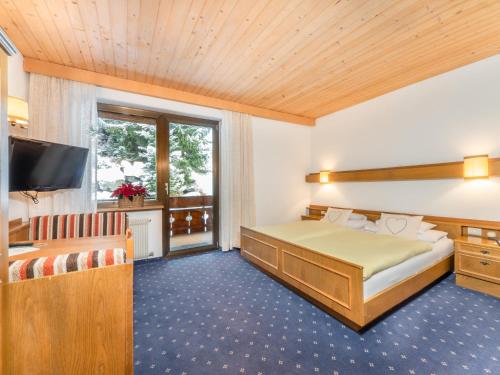 Postel nebo postele na pokoji v ubytování Hotel Pontives