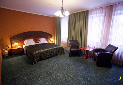Voodi või voodid majutusasutuse Luna Hotel toas