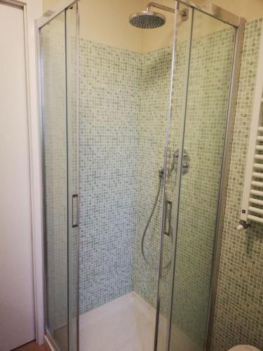 a bathroom with a shower with a glass door at Via Funicolare in Brunate
